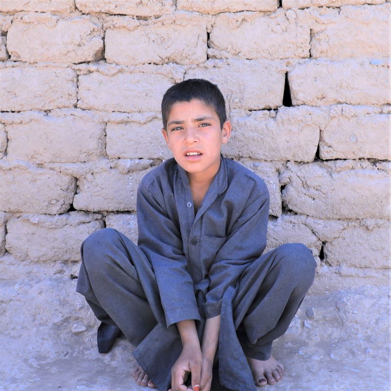 Aimal, 11, is of millions of people displaced by drought. He lives in Shahrak Sabz in Afghanistan and is solely responsible for providing for his six younger siblings, his mother and himself. Every day Aimal goes to the city to beg and sell garbage for recycling.